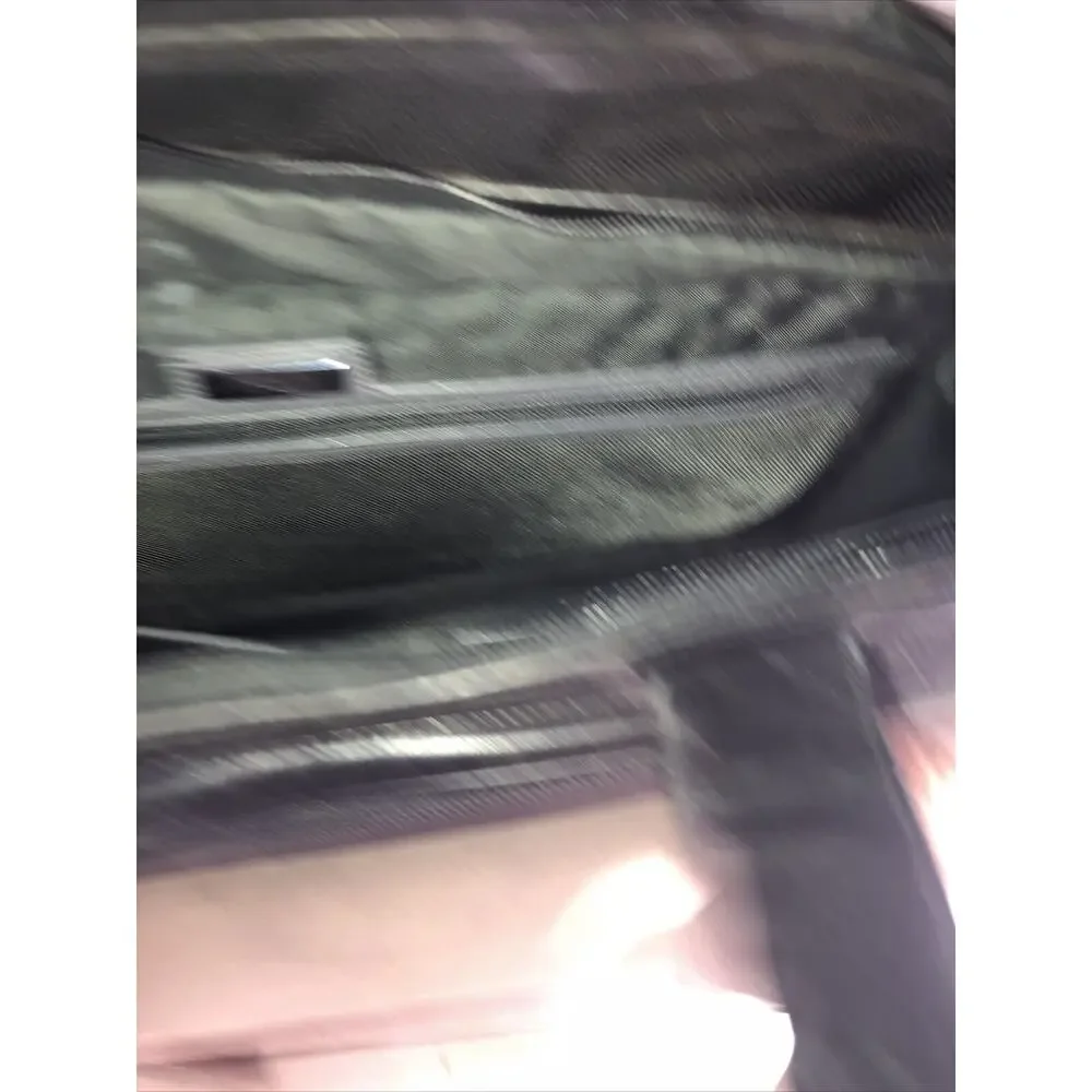 Tumi expandable leather
